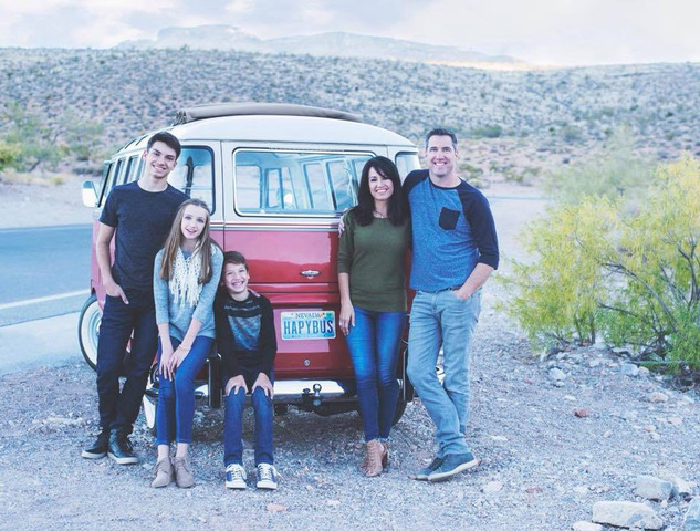 Dr. Saxe and her family posing in front of a van in las vegas