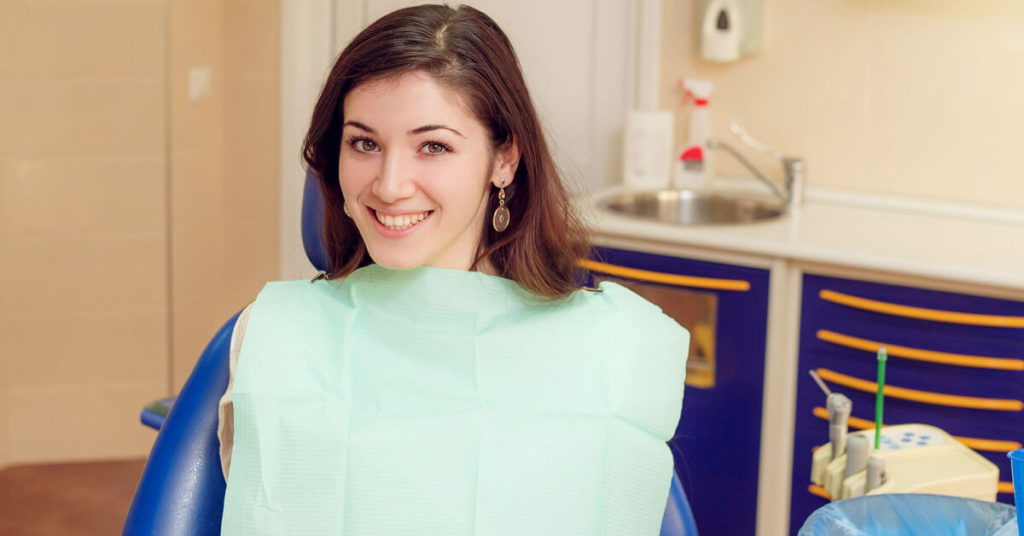 Adult female smiling at an Orthodontist consult