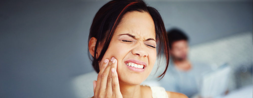 Woman in pain because of bruxism