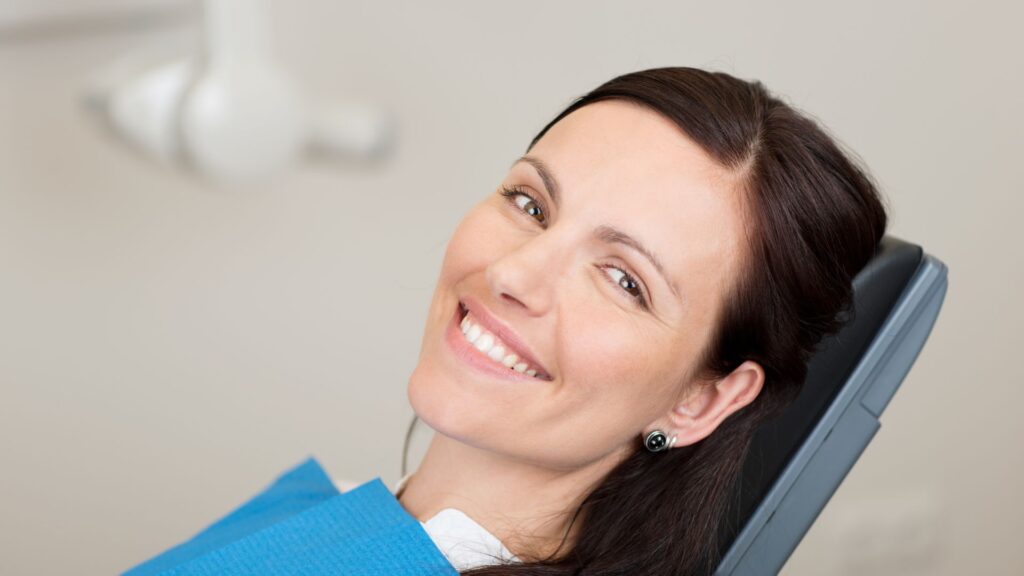 adult at dentist for her dental cleanings with braces