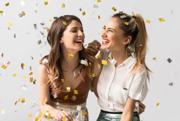 adults celebrate in confetti all the reasons to get braces in the new year