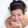 bride smiles in wedding dress after using the fastest way to straighten teeth before wedding