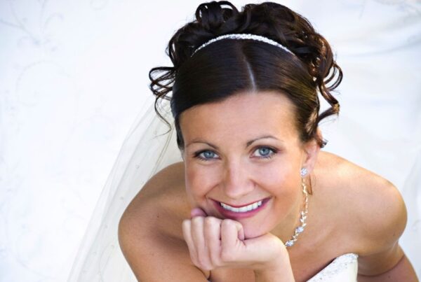 bride smiles in wedding dress after using the fastest way to straighten teeth before wedding