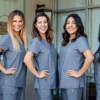 Saxe Orthodontics team members lined up, smiling, personalized orthodontics - braces and clear aligners in Summerlin, Las Vegas, NV